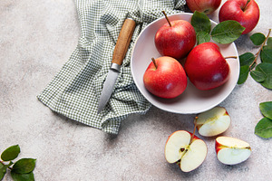 Fresh red apples in bowl with knife, a Food & Drink Photo by Olena Rudo