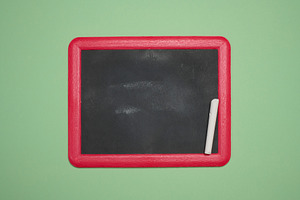 Blank chalkboard in a pink wooden frame, white chalk lying on th, a School & Education Photo by ndanko