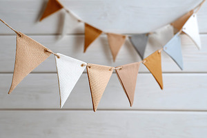 Minimalist paper bunting flags adorn the space with charm and simplicity, a Holiday Photo by AlyaAnd