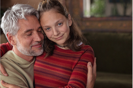 Portrait of teenage daughter hugging, a Person Photo by HalfPoint