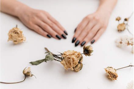 Dry rose flower in front of woman, a Beauty & Fashion Photo by P&G