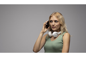 Blonde young woman with headphones, a Person Photo by volodymyrshtun13795