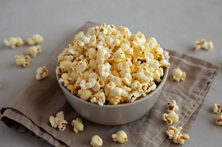 Homemade Salty Popcorn in a Bowl, side view., a Food & Drink Photo by LiudmylaChuhunova