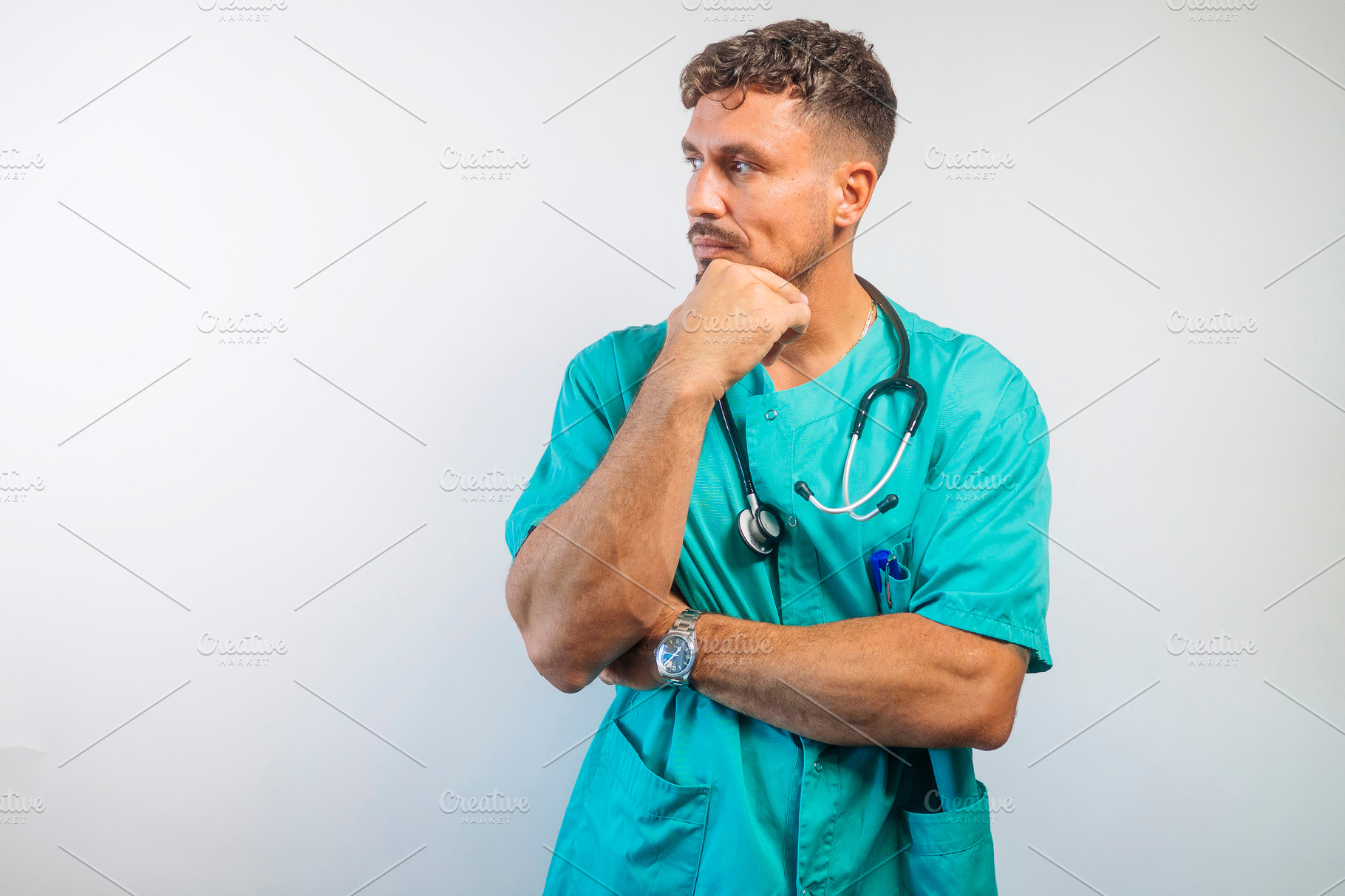 Doctor Thinking with Hand on Chin, a Person Photo by karrastock