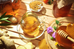 Honey and ginger infusion on wooden table as alternative medicin, a Food & Drink Photo by Davizro's Market