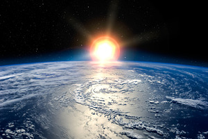 Sunrise in outer space featuring earth, planet, and cosmos
