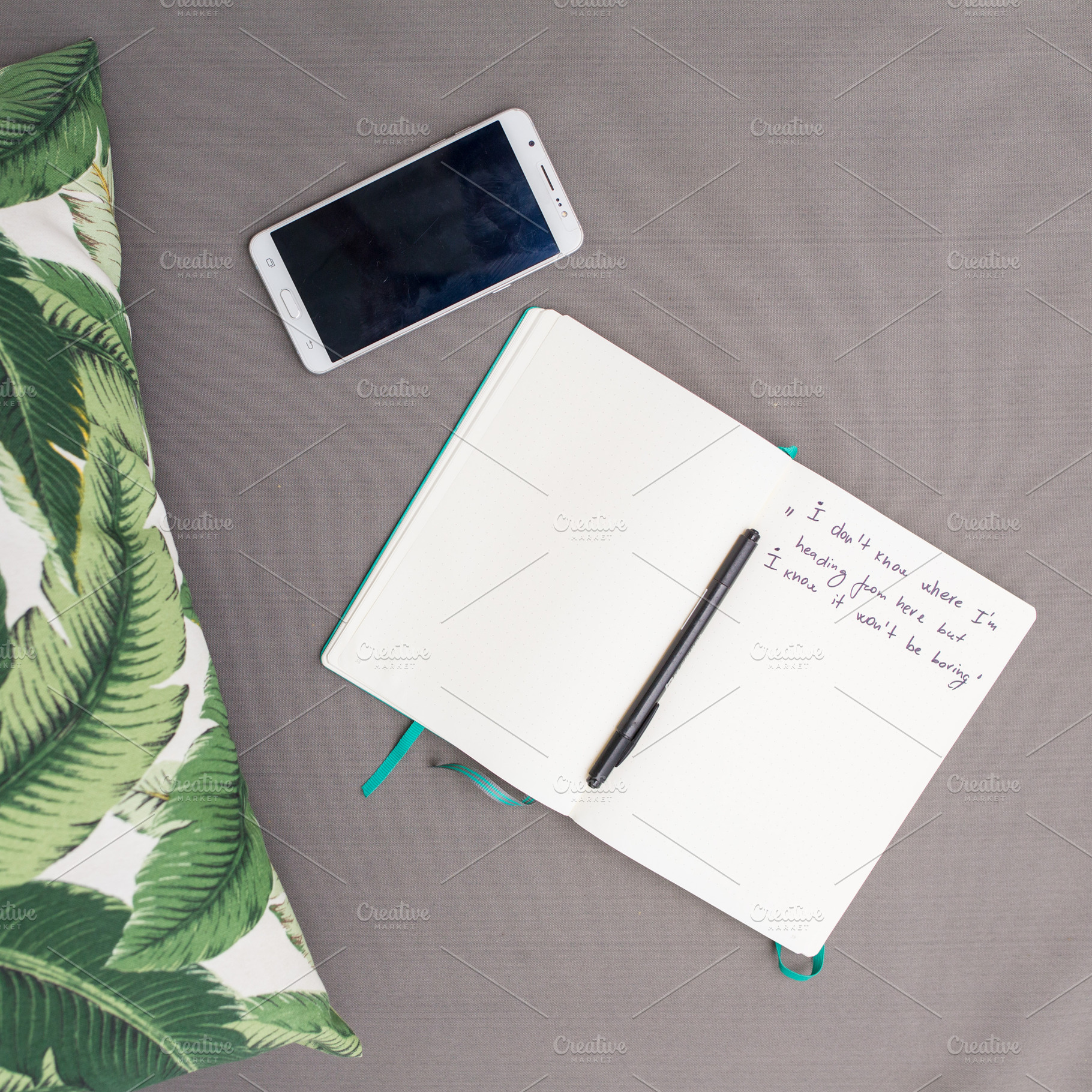 Detail of mobile phone and a journal, a Technology Photo by Beach Babe Stock