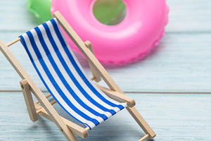Relaxing beach vibes with colorful pool floats, a Holiday Photo by Olena Rudo