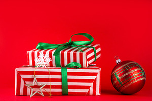 Bright high-colored background with Christmas boxes, festive bau