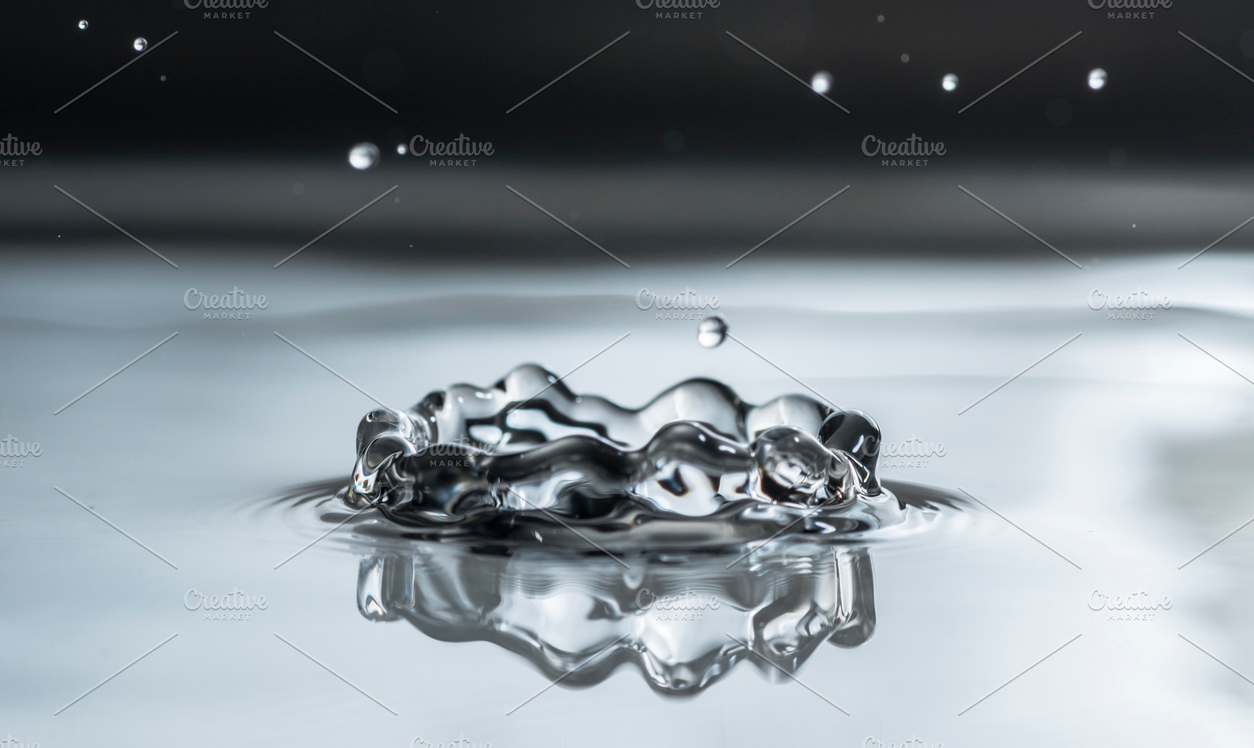 Water drop containing water, splash, and background, a Nature Photo by DegImages