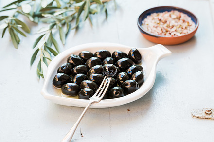 Black olives in white ceramic plate stock photo containing olive and black, a Food & Drink Photo by Foxys