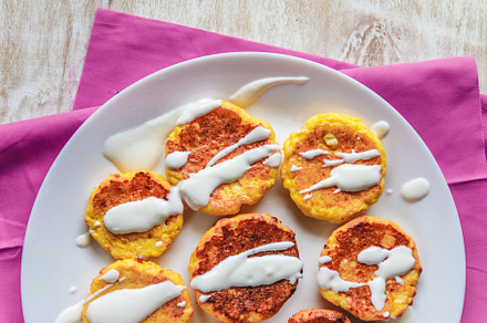 Curd cheesecakes, pancakes with sour cream on a plate and a ligh, a Food & Drink Photo by TanaCh