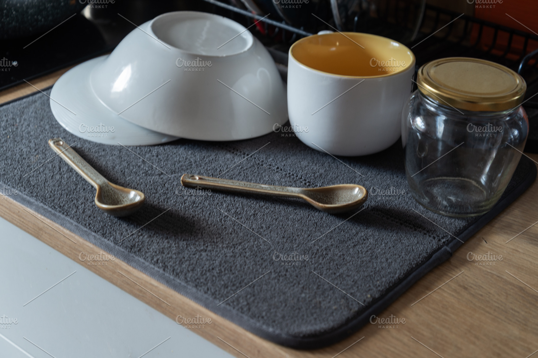 Everyday kitchen still life with washed dishes drying on a gray, an Industrial Photo by MDBildes