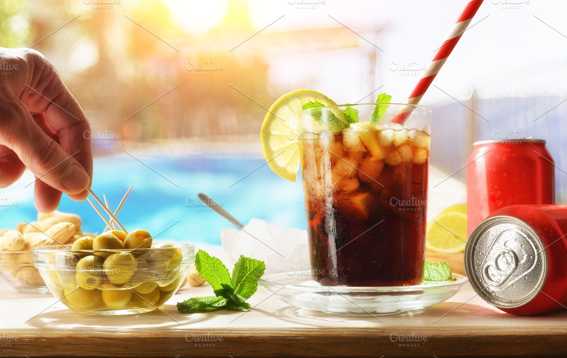 Cola soda on wooden table with appetizers around the pool, a Food & Drink Photo by Davizro's Market