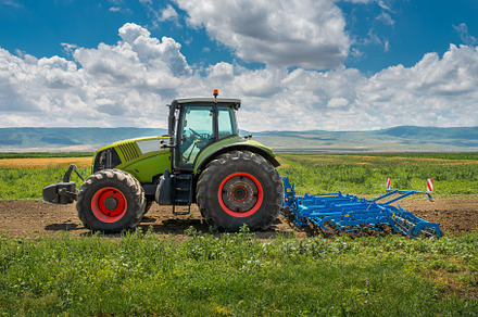 Tractor Cultivates The Land, an Industrial Photo by David Khelashvili