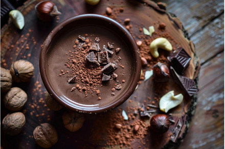 Gourmet chocolate dessert with nuts, a Food & Drink Photo by Ylivdesign