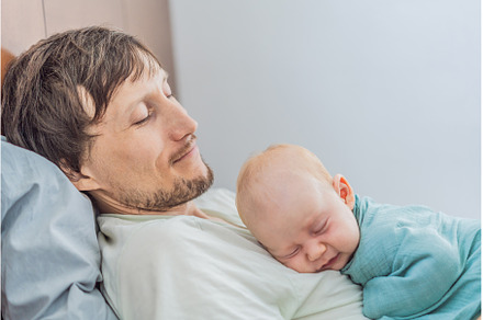 Newborn baby peacefully sleeps on
