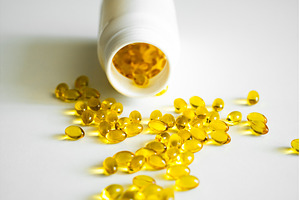 Golden yellow softgel capsules, a Health & Medical Photo by volodymyrshtun13795