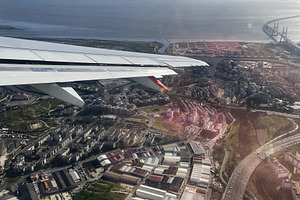 Aerial view of Lisbon coast with Vasco da Gama bridge and cityscape visible, a Photo by AS photostudio