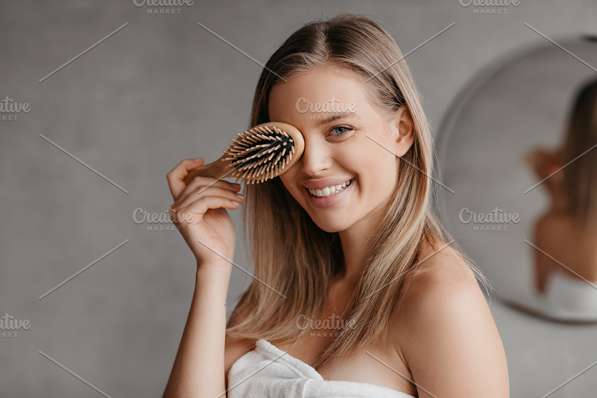 Hair care concept. Pretty young lady wrapped in white towel covering eye with h, a Photo by Prostock-Studio (Photo 1 of 3)