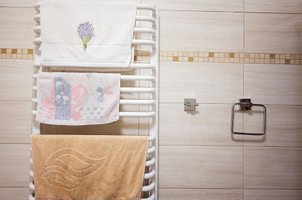 Towels in the bathroom interior. Bath accessories., a Photo by AS photostudio