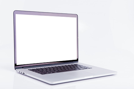 Laptop with blank screen containing laptop, computer, and isolated
