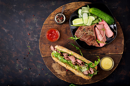 Sandwich with roast beef containing closeup, roast, and meal