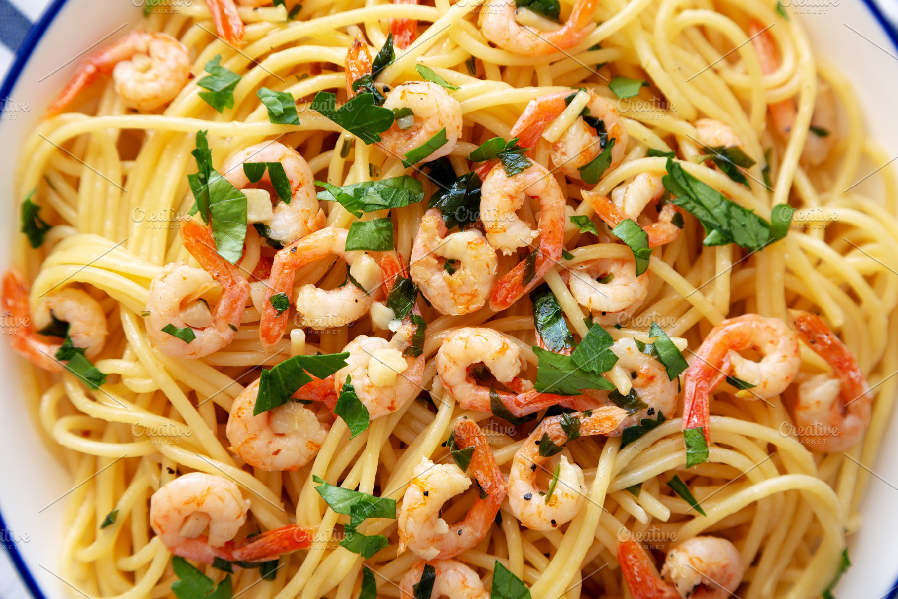 Homemade Garlic Shrimp Scampi with Parsley on a Plate, top view., a Food & Drink Photo by LiudmylaChuhunova