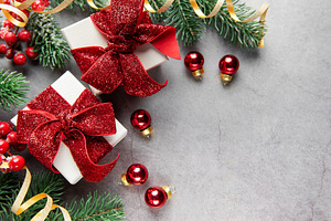 Christmas gifts and decorations forming festive background, a Holiday Photo by Olena Rudo