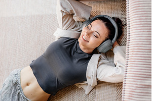 Woman relaxing at home, enjoying, a Person Photo by HalfPoint