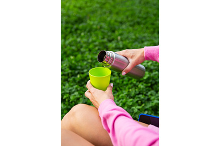 Girl traveler pours tea from a, a Person Photo by Artsaba Family