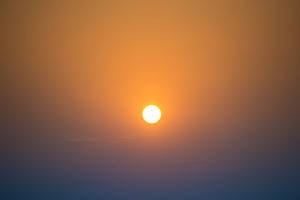 Sunset in the sky with big sun