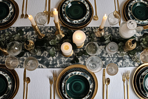 Elegant dining table setting for a dinner party, featuring green and gold decor, a Food & Drink Photo by Studio ANNA