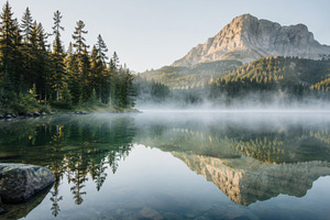 Mountain and lake reflect in morning, a Photo by Beautiful things