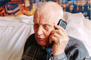 Elderly man engaged in a phone, a Technology Photo by darksoul72