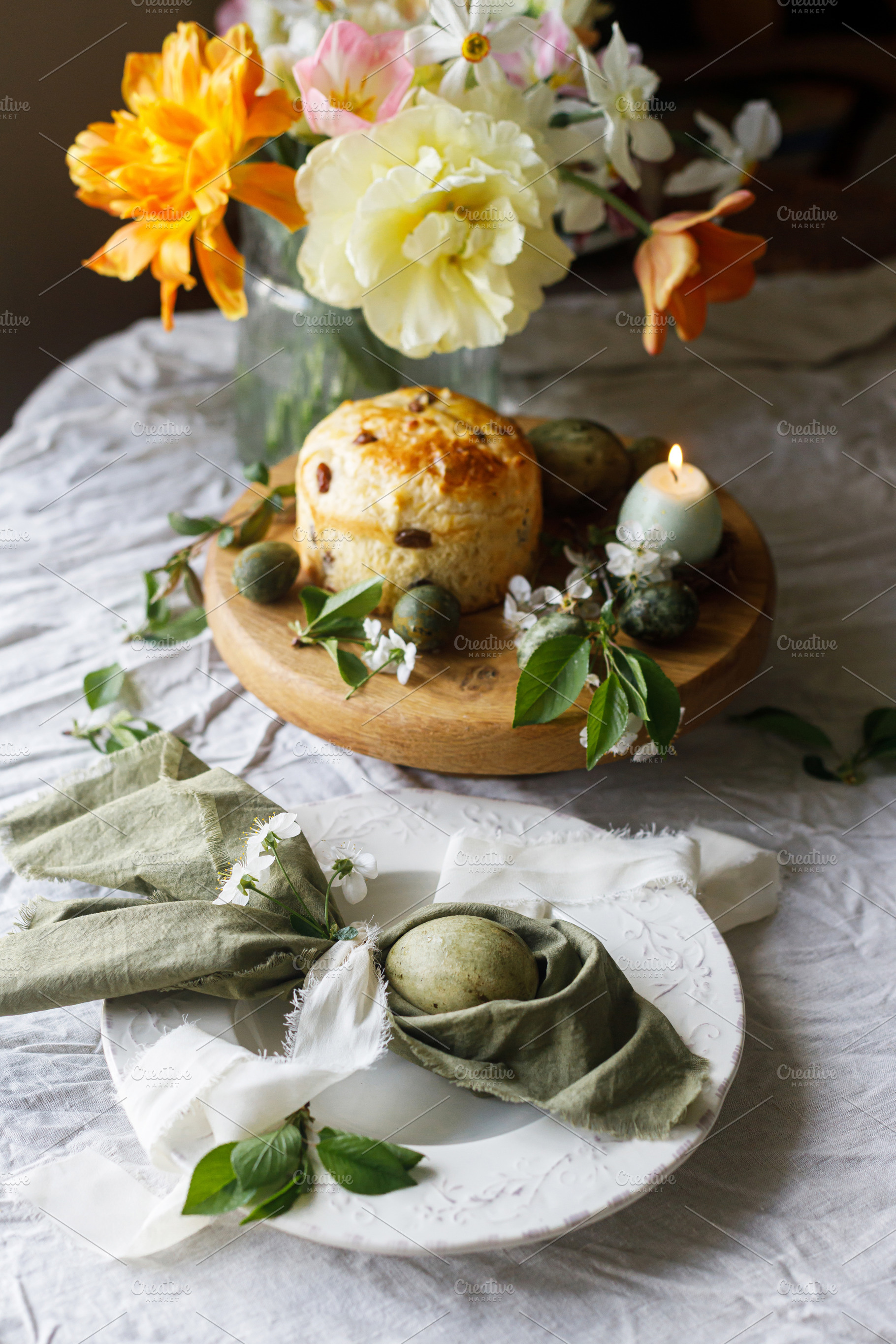 Easter celebration. Stylish green easter eggs in bunny ears napk, a Holiday Photo by Sonjachni