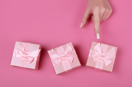 woman chooses pink gift box, a Holiday Photo by Alim Yakubov