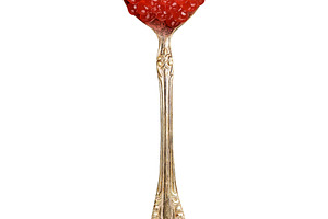 Red caviar of chum salmon in a metal spoon, isolated background, a Food & Drink Photo by ndanko