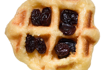 Waffle with raisins isolated on white background