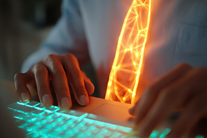 Individual wearing glowing neon tie while typing on a laptop during nighttime c, a Photo by AlyaAnd