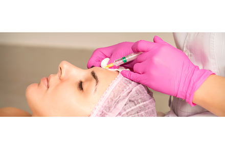 Woman receiving injection of botox, a Health & Medical Photo by okskukuruza