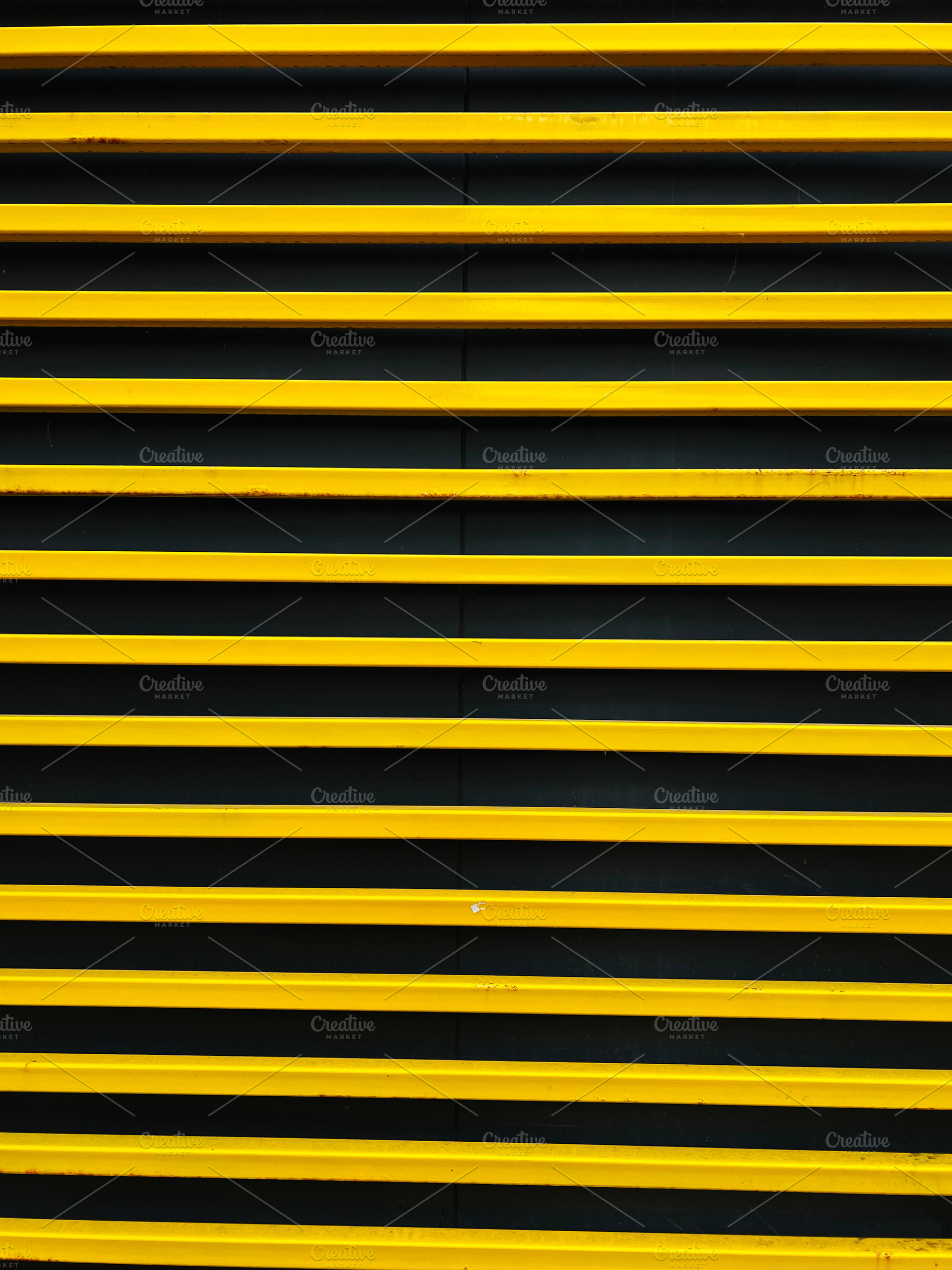 Yellow horizontal bars on a dark background creating a striking pattern, a Photo by AS photostudio