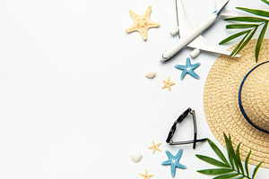 Summer vacation concept featuring airplane, sunglasses, straw ha, a Holiday Photo by Olena Rudo