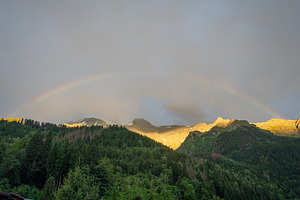 Rainbow over mountain forest at Contamines Montjoie, France, a Nature Photo by GoodGoods