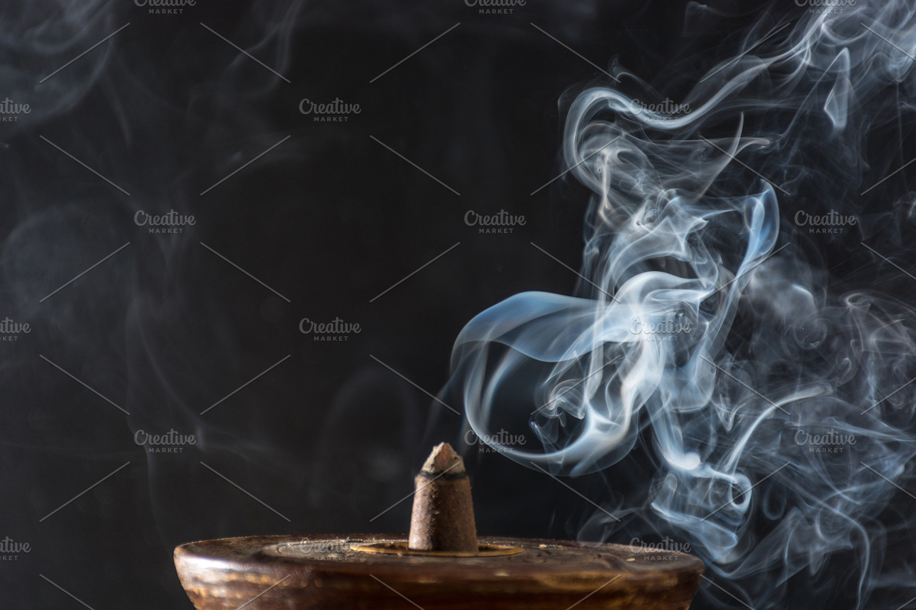 Various incenses on black background containing abstract, aroma, and, a School & Education Photo by expressiovisual