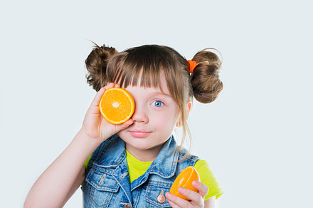 Baby girl with a smile and orange stock photo containing background and