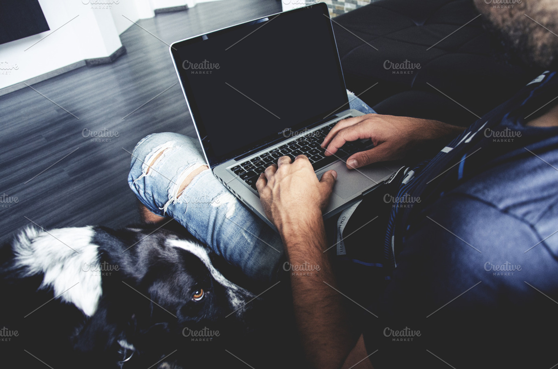 Man Holding A White Mac Laptop