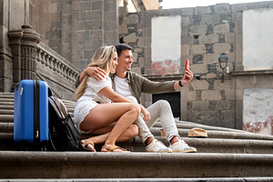 Tourist couple taking a selfie, a Person Photo by etorres69