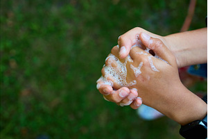 Washing hands with soap outdoors to, a Nature Photo by IlliaBondarPhotography