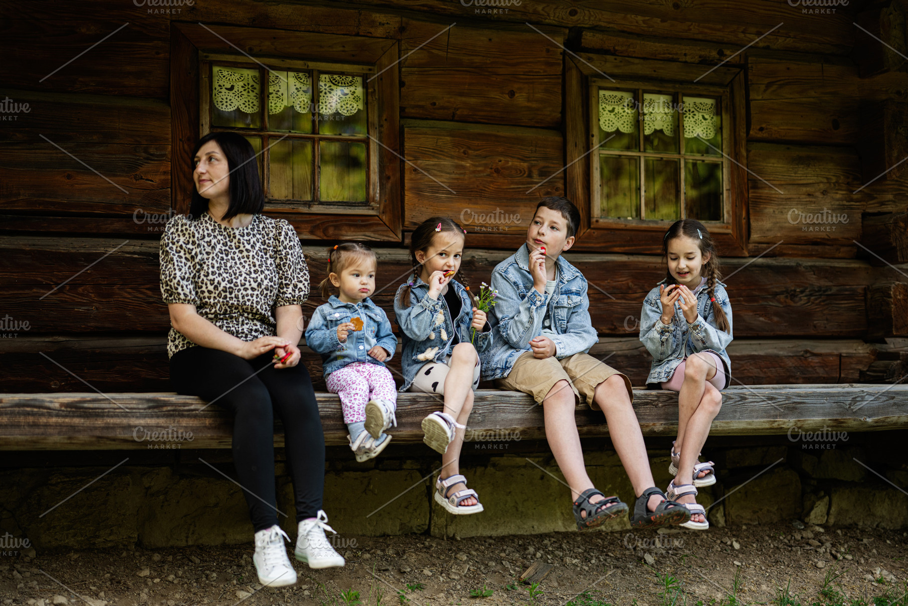 Family enjoying time together in front of a rustic wooden building, a Person Photo by AS photostudio